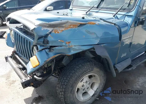 1999 Jeep Wrangler Sport z USA, uszkodzony, nr VIN 1J4FY19S8XP443604